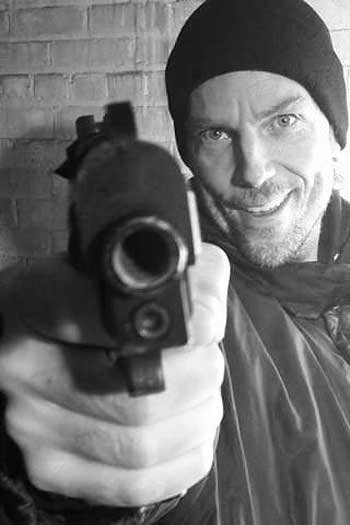 kris eivers holding a gun